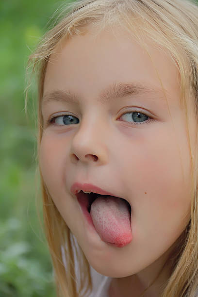 istock Preschooler with put out tongue 474500317