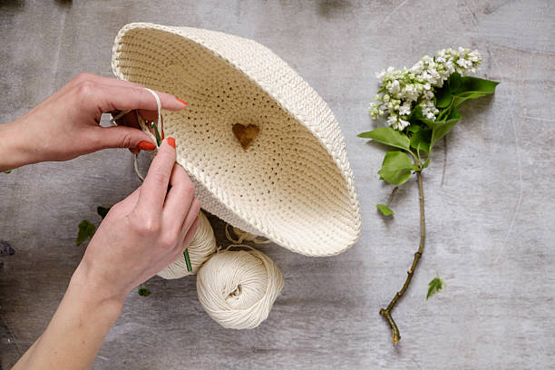 istock hand crochet and blue threads on wooden table 474501382