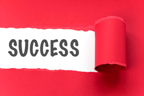 istock tearing the word success 474501790