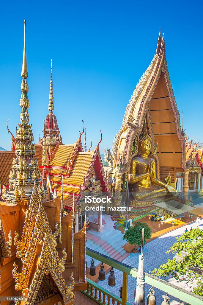 Wat Tham Sua(Tiger Cave Temple) A view from the top of the pagoda, golden buddha statue with rice fields and mountain, Wat Tham Sua(Tiger Cave Temple), Tha Moung, Kanchanburi, Thailand 2015 Stock Photo