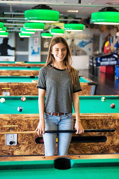 istock Woman Smiling near Billiards Ball 474506632