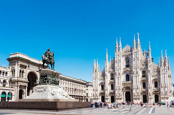 Duomo square with statue of Victor Emanuel 2nd. Milan, Italy. from the wide angle view. The entrance of gallery arcade of Victor Emanuel2nd, the statue of him riding on the horse. milan stock pictures, royalty-free photos & images