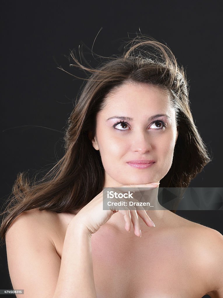 Portrait of beautiful woman with flying hair and smooth skin Beautiful caucasian woman on the isolated background 25-29 Years Stock Photo