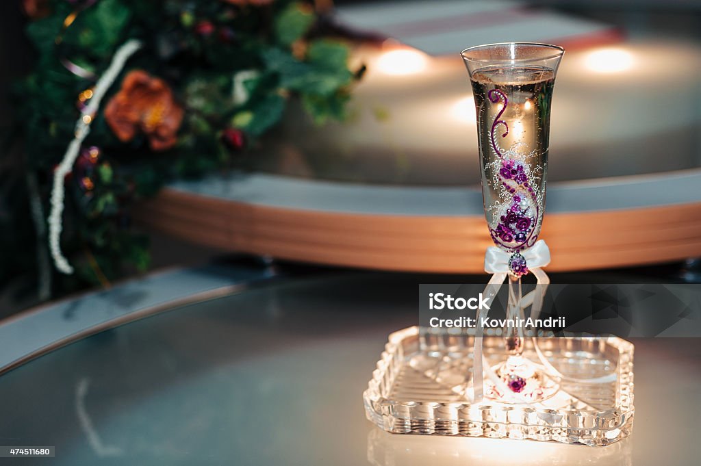 Festive table setting with roses in dark colors  on a Festive table setting with roses in dark colors  on a beige background. 2015 Stock Photo