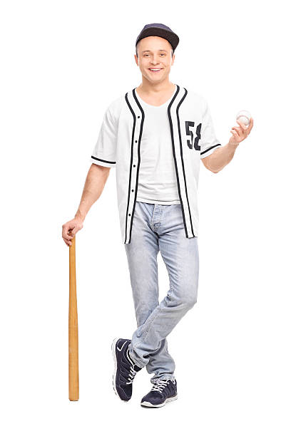 istock Young baseball player posing with bat and a ball 474512180