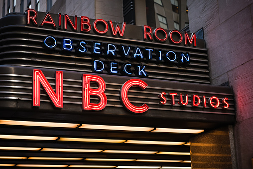 New York, USA - March 21, 2015: The famous NBC Rainbow Room neon sign late in the night in Times Square. 