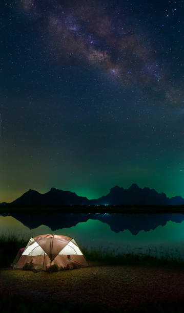 istock tent camping around The Milky Way 474516928