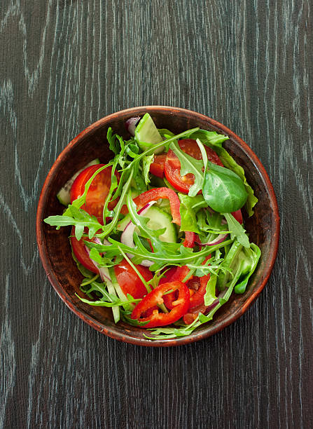 istock Vegetable salad over dark wood background 474517209