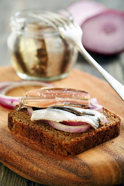 istock Black bread, onions and anchovies. 474518669