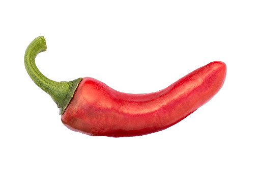 The Espelette pepper (piment d'Espelette) comes from the french town Espelette in the Basque Country, Pyrenees-Atlantiques, France. It is a rather mild chili pepper with an heat level of 2 (from 0 to 10). One ripe red pod isolated on white background.