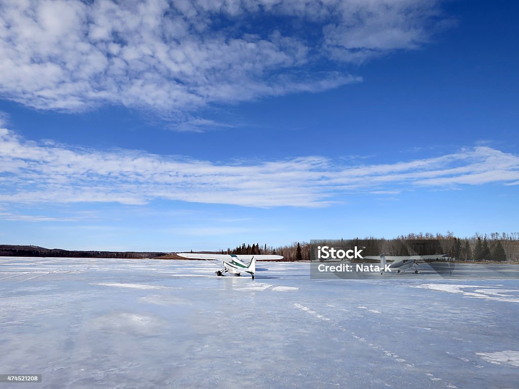 Airplanes on frozen lake Airplanes on frozen Stoney Lake, ice (winter) fishing, AB, Canada Canada Stock Photo