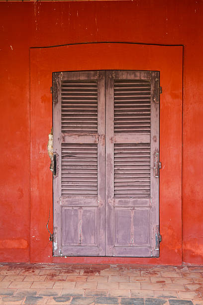 istock Wooden door with red walls 474521685