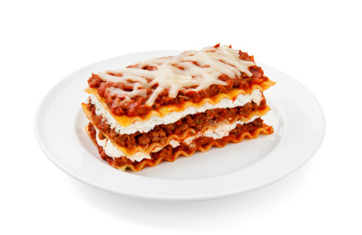 Meat lasagna isolated on white background.  Please see my portfolio for other food and drink images.