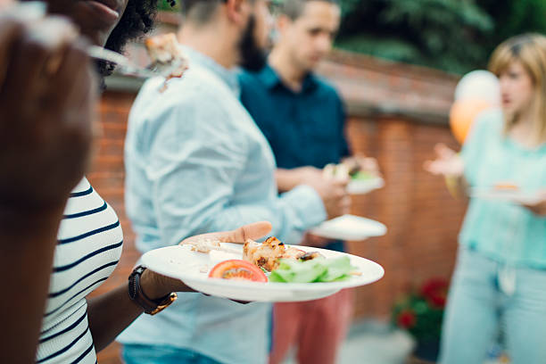istock Unrecognizable People Eating At Barbecue Party. 474522384