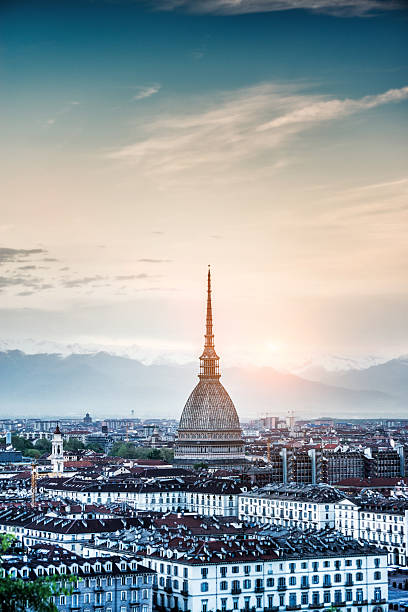 Panoramic View of Turin (Torino) at Sunset Panoramic View of Turin (Torino) at Sunset. Visible are the old part of Turin, many traditional Italian historic building, Mole Antonelliana and beautiful sunset sky over the snowy alps in the background. olympic peninsula photos stock pictures, royalty-free photos & images