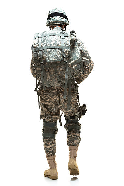 istock Rear view of army soldier walking 474522991