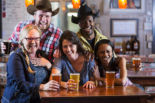 istock Group of friends drinking beer in a restaurant bar 474523228