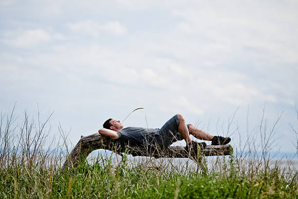 istock Young Adult Relaxing Peacefully in Nature 474525091