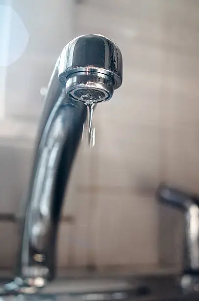a drop of water from a leaking tap