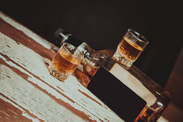 istock Two glasses of whiskey standing on the bar 474527430