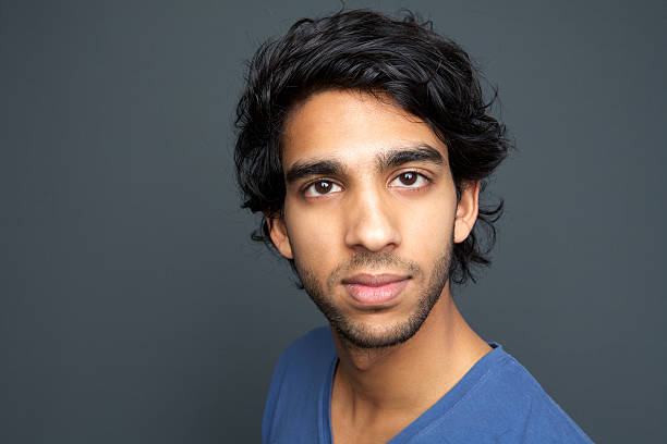 istock Portrait of a young man staring 474527923