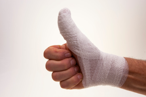 White medicine bandage on human injury hand fingers