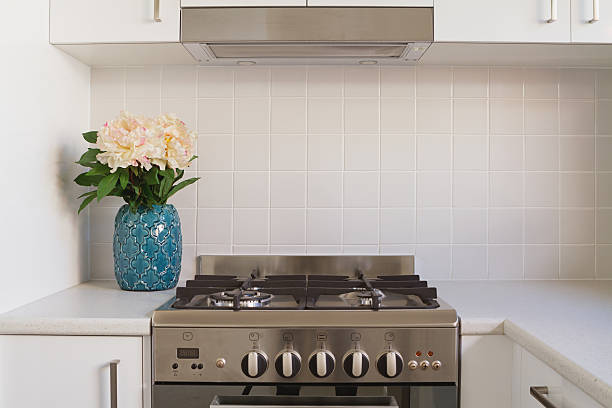 istock Close up of kitchen oven and tiled splash back 474537508