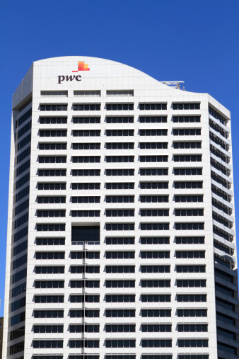 Sydney, Australia - October 26, 2013: The Price Waterhouse Cooper building in Sydney Australia with the PWC sign on the front of the building
