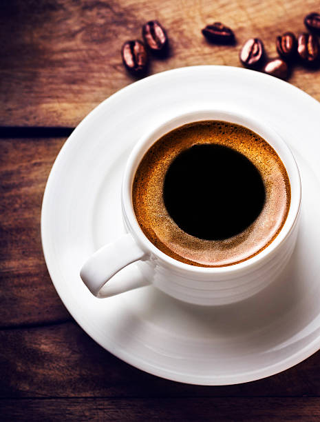 istock Coffee cup with roasted cofee beans  on wooden background, 474549479