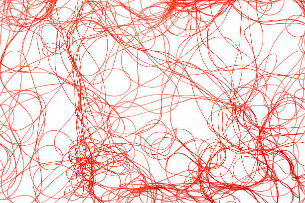 istock Isolated shot of red silk thread on white background 474551540