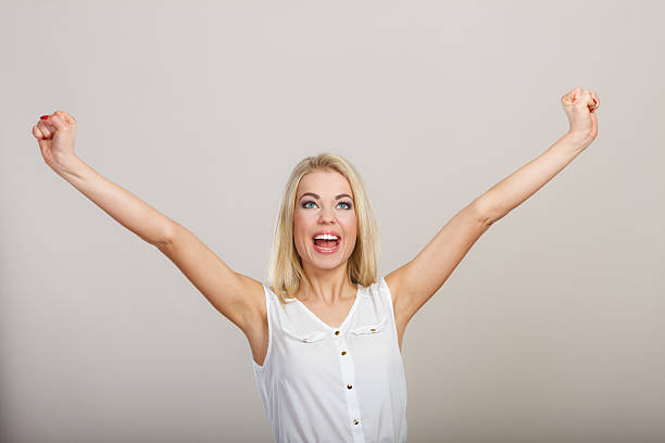 istock Blonde girl spreading hands with joy, 474552614