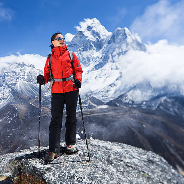 istock Woman looking at view, Mount Ama Dablam on background 474552890