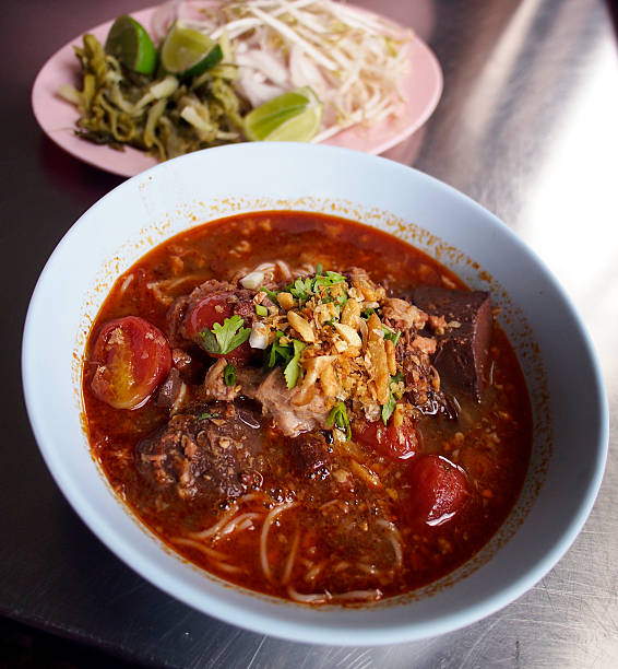rice noodles with spicy pork sauce rice noodles with spicy pork sauce on table rice noodel stock pictures, royalty-free photos & images