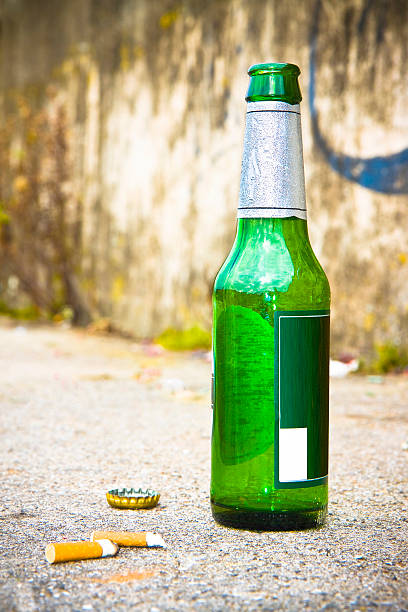 istock Bottle of beer resting on the ground 474561990