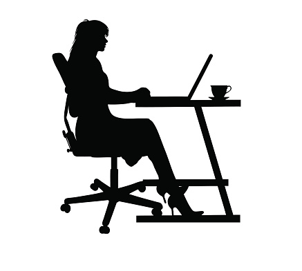 Silhouette of a woman typing at a laptop isolated