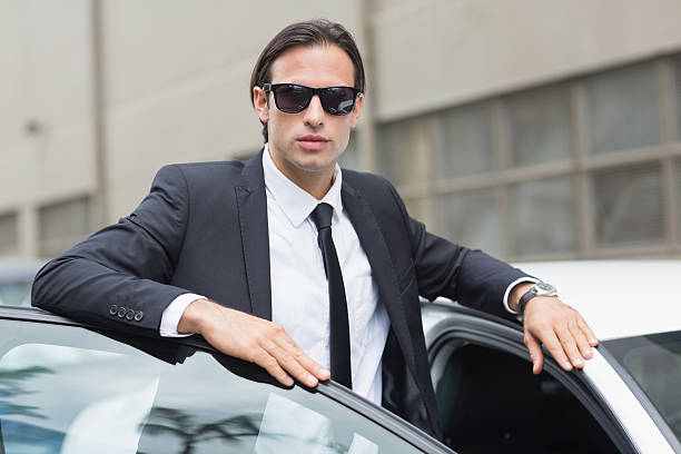 istock Businessman leaning on the door 474563212