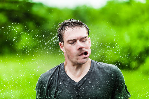 istock Young Adult Completely Drenched Shaking His head 474563843