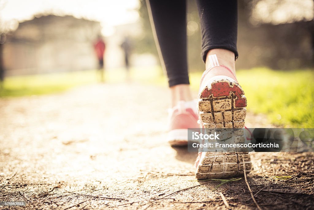 jogging shoes closeup Close up shoot of a woman's running shoes in the nature. Active Lifestyle Stock Photo