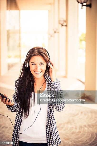 Young Happy Woman With Ear Phone Stock Photo - Download Image Now - 20-24 Years, Adolescence, Adult