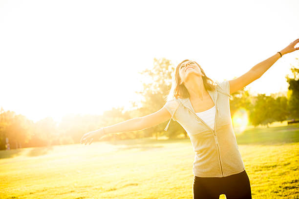istock Happy woman at the park 474564771