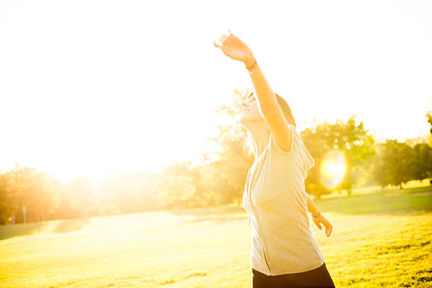 istock Happy woman at the park 474564803
