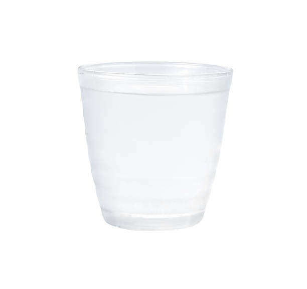 istock pouring water on a glass on white background 474569460