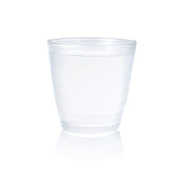 istock pouring water on a glass on white background 474569464