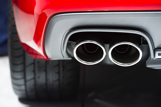 Exhaust pipe Chrome exhaust pipe of red powerful sport car bumper  exhaust pipe photos stock pictures, royalty-free photos & images
