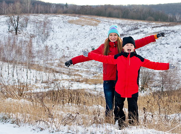istock Laughing children together outdoors in winter. 474570771