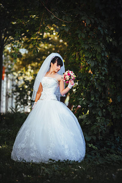 istock Beautiful bride posing in her wedding day 474573336