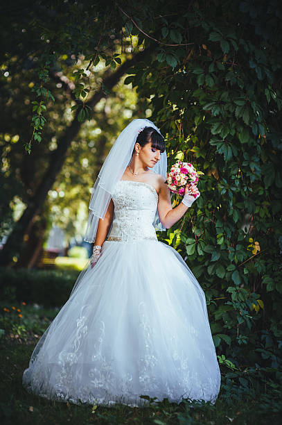 istock Beautiful bride posing in her wedding day 474573346