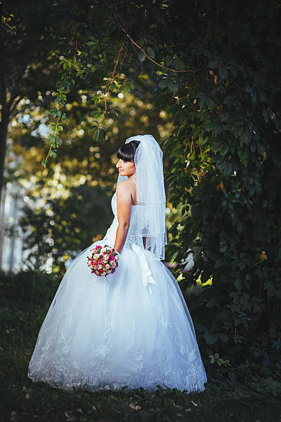 istock Beautiful bride posing in her wedding day 474573348