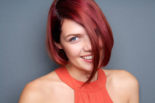 istock Young woman laughing with red hair 474574129