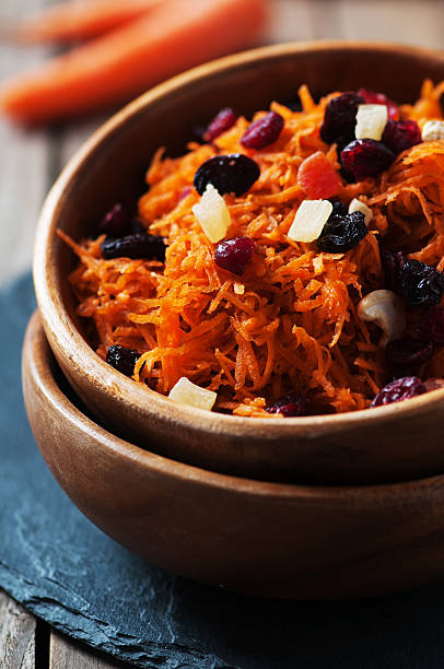 istock Carrot salad with raisins on the wooden table 474574740
